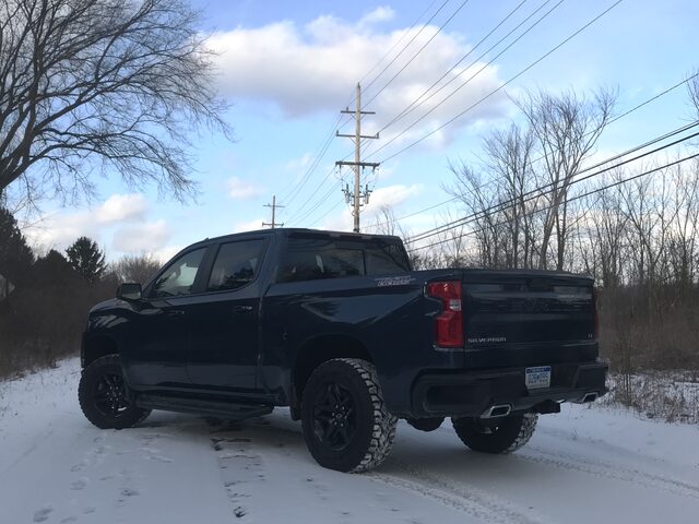 2019 Chevrolet Silverado LT Trail Boss, Rear Three-Quarter View in Snow