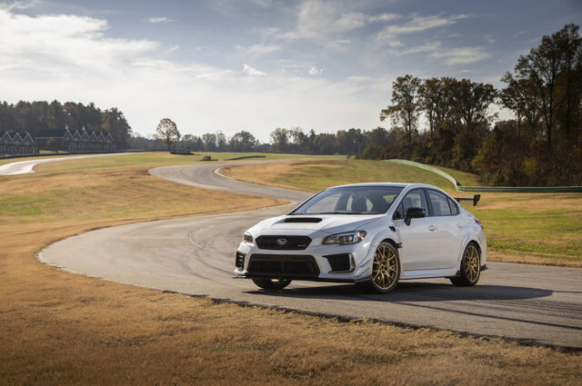2019 Subaru WRX STi S209, front three-quarter static shot on track with gold wheels