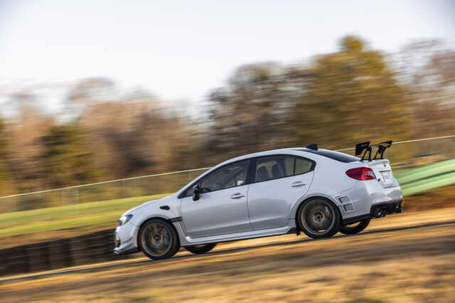 2019 Subaru WRX STi S209, side profile panning shot on track in autumn