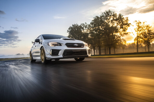 2019 Subaru WRX STi S209, low front three-quarter action shot at sunrise on track