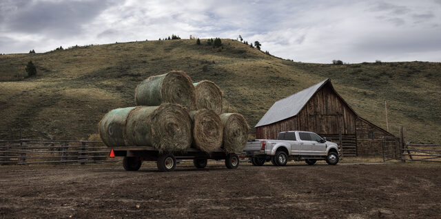 2020 Ford F-Series Super Duty, towing hay bales on a ranch