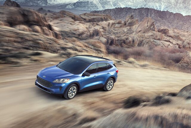 2020 Ford Escape Titanium Front Three-Quarter Driving Desert Rocks