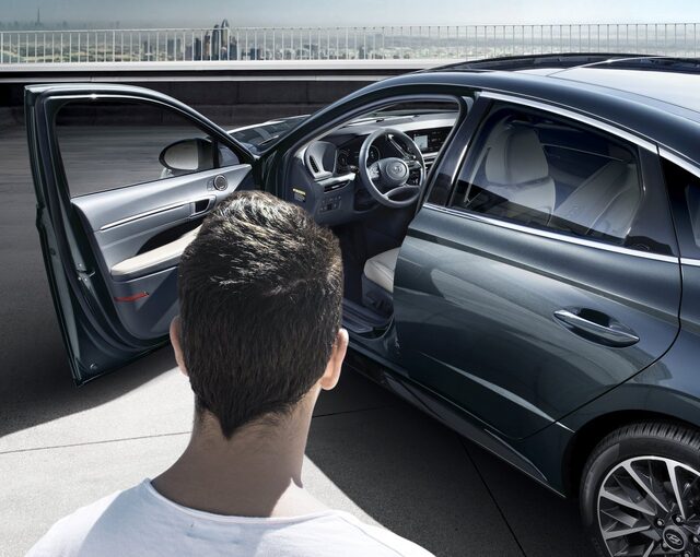 2020 Hyundai Sonata Dark Blue Exterior Open Door Lifestyle Shot