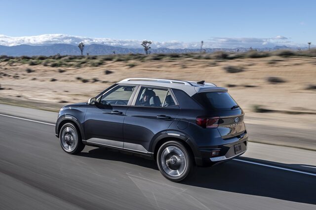 2020 Hyundai Venue SEL driving shot rear three-quarter [desert highway]