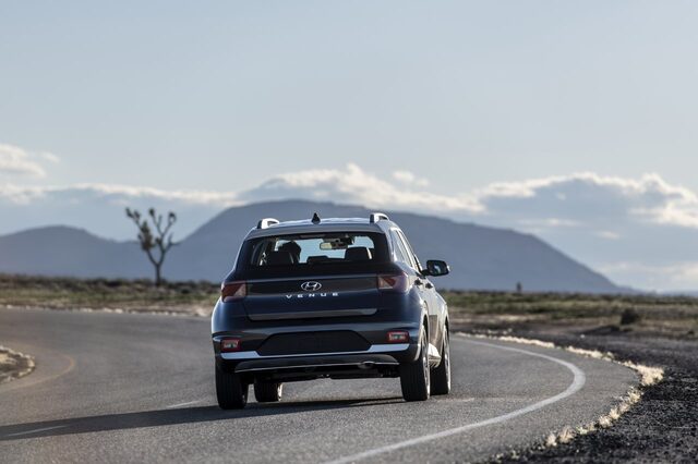 2020 Hyundai Venue SEL driving shot rear straight [desert road]