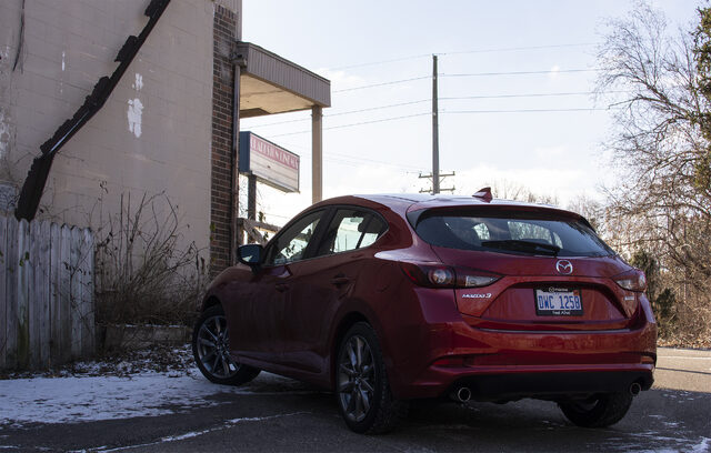 2018 Mazda3 Grand Touring Hatchback Rear Three-Quarter View on Urban Street
