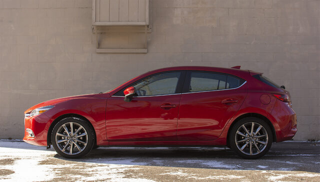 2018 Mazda3 Grand Touring Hatchback Passenger Side Profile View Against Concrete Wall