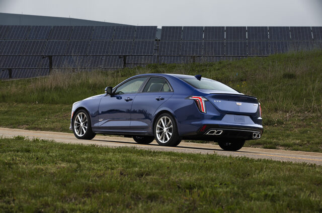 2020 Cadillac CT4-V rear three-quarter view with solar panels in background