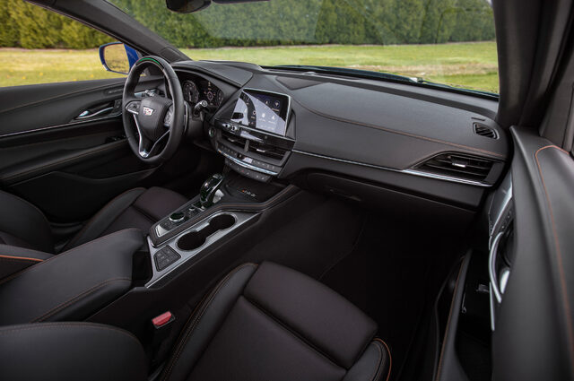 2020 Cadillac CT4-V interior from passenger side showing dashboard and infotainment