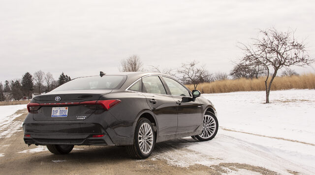 2019 Toyota Avalon Hybrid Limited rear three-quarter view in winter