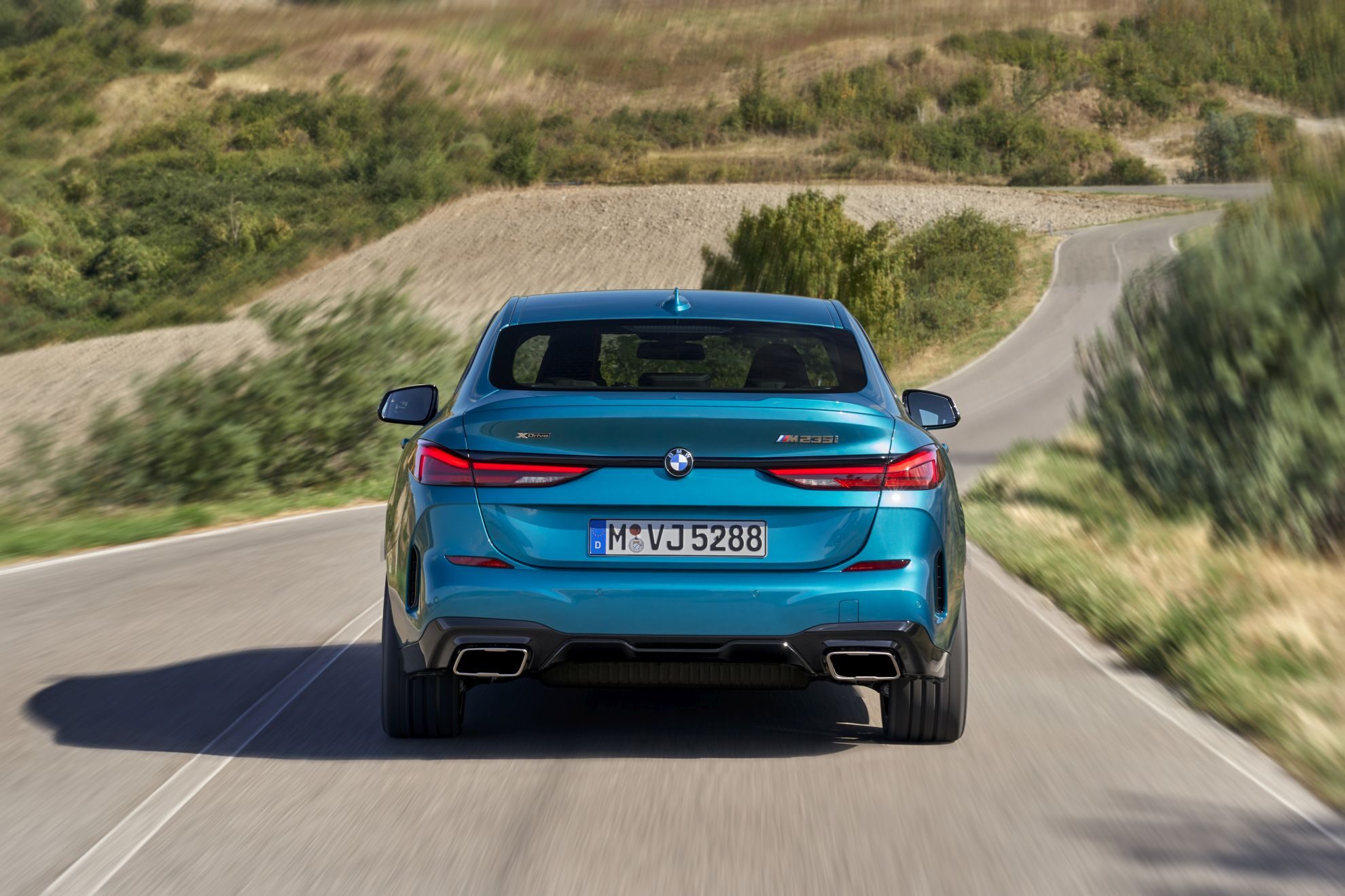 2020 BMW 2 Series Gran Coupe studio rear view in Storm Bay Metallic