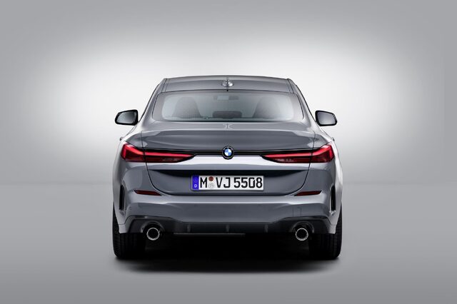 2020 BMW 2 Series Gran Coupe rear three-quarter studio shot in Storm Bay Metallic