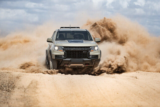 2021 Chevrolet Colorado ZR2 blasting straight through sand dune wall