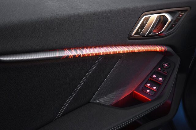 2020 BMW M235i xDrive Gran Coupe open rear door with landscape backdrop