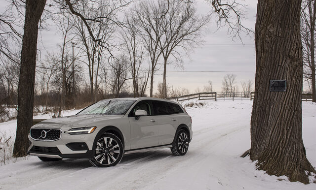 2020 Volvo V60 Cross Country, parked on snowy rural road flanked by trees