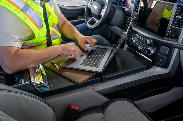 2021 Ford F-150 under-seat storage drawer open with work gear