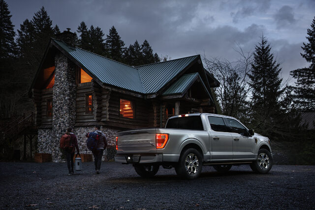 2021 Ford F-150 at construction site with building and excavator