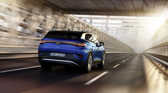 2021 Volkswagen ID.4 rear view driving through a bridge tunnel