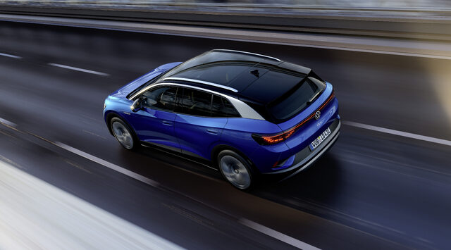 2021 Volkswagen ID.4 rear three-quarter view in motion on highway