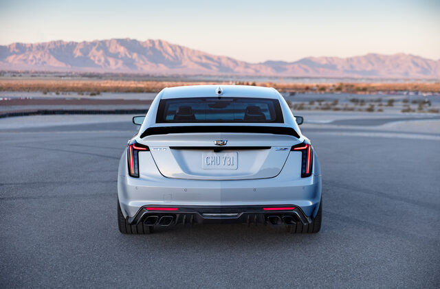 2022 Cadillac CT5-V Blackwing, rear straight view with quad exhaust at desert dusk