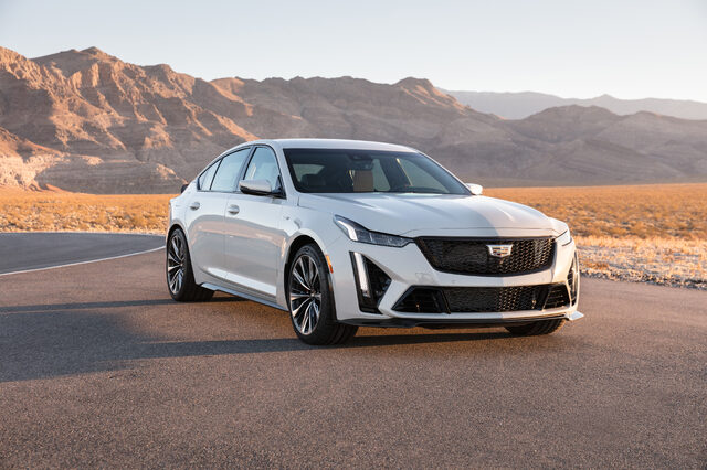 2022 Cadillac CT5-V Blackwing, front 3/4 view on desert road at golden hour
