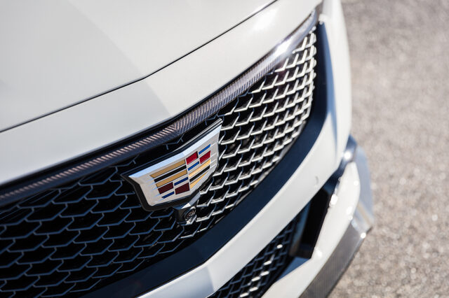 2022 Cadillac CT5-V Blackwing, Cadillac grille badge and carbon fiber front splitter closeup