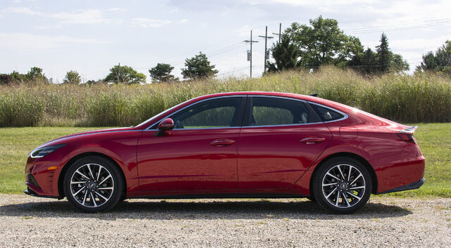 2020 Hyundai Sonata Limited 1.6T driver-side profile in red with fastback roofline