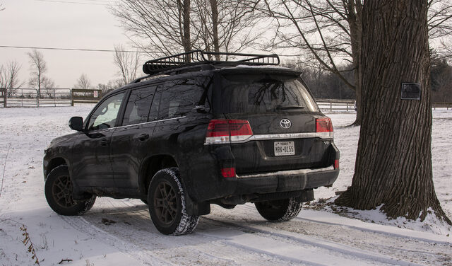 2020 Toyota Land Cruiser Heritage Edition rear three-quarter winter farm
