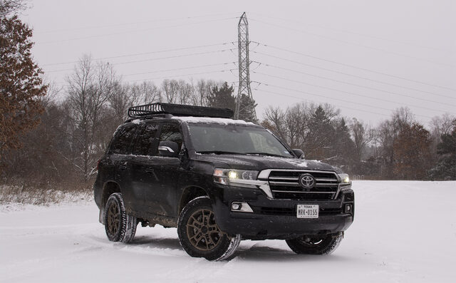2020 Toyota Land Cruiser Heritage Edition front three-quarter snow field