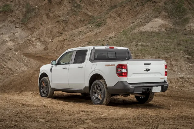 2023 Ford Maverick Tremor rear three-quarter off-road in white