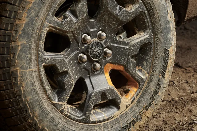 2023 Ford Maverick Tremor mud-covered wheel and all-terrain tire