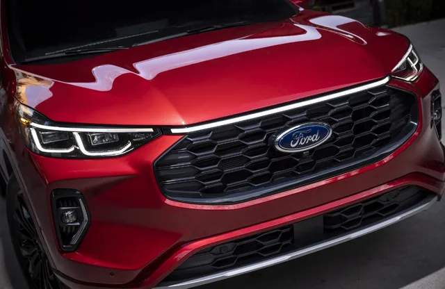 2023 Ford Escape ST-Line Grille and Headlight Close-Up in Rapid Red