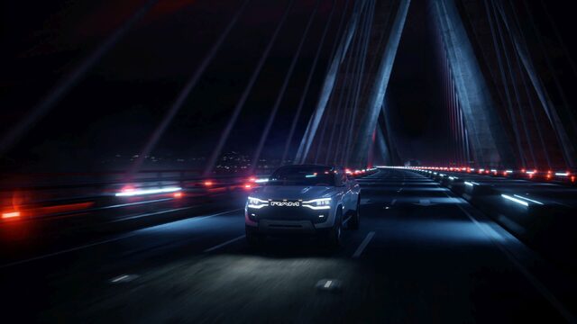 RAM 1500 Revolution Concept Front View Driving on Bridge at Night
