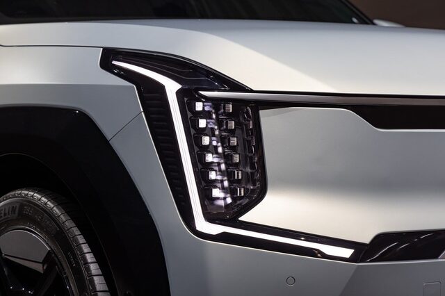 2024 Kia EV9 Digital Tiger Face headlight close-up showing the Star Map DRL and angular LED lighting signature