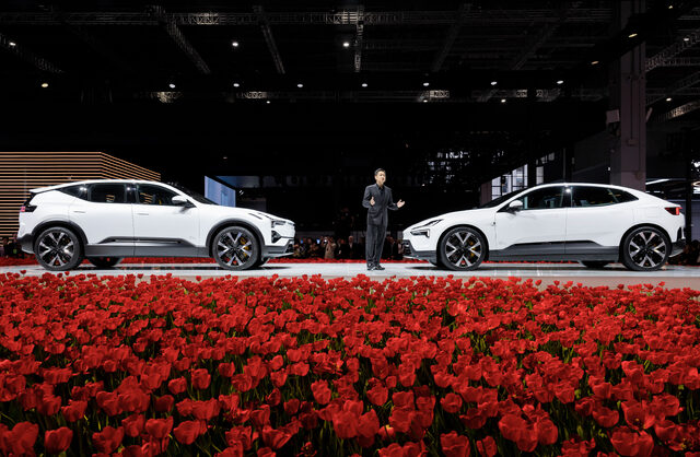 Polestar 4 and Polestar 3 Wide Stage Shot with Presenter