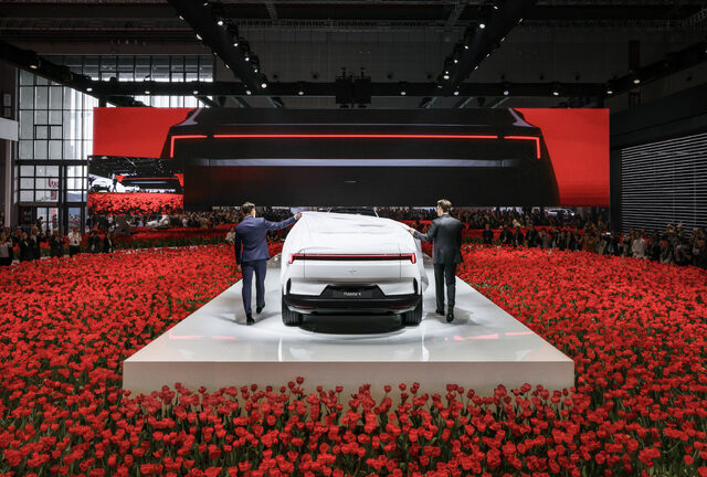 Polestar 4 Rear View Reveal on Stage Surrounded by Red Tulips
