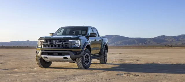 2024 Ford Ranger Raptor front three-quarter view on dry lake