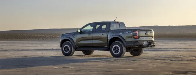 2024 Ford Ranger Raptor rear three-quarter view at sunset