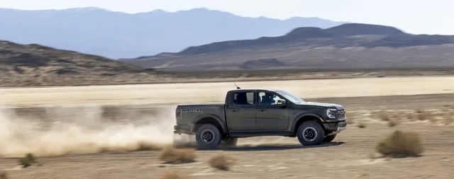 2024 Ford Ranger Raptor side profile at speed in desert