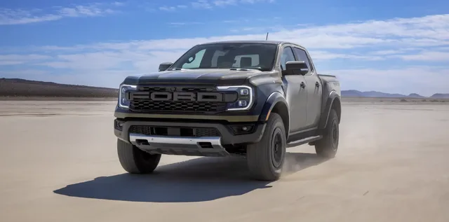 2024 Ford Ranger Raptor front three-quarter view on dry lake bed