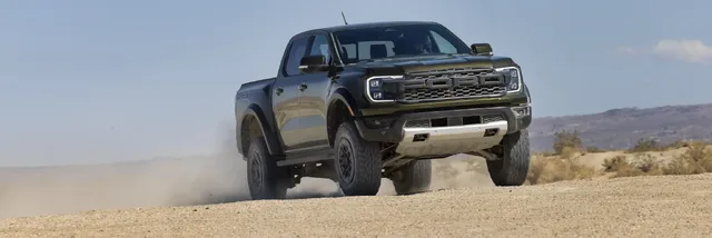 2024 Ford Ranger Raptor front three-quarter action shot jumping in desert