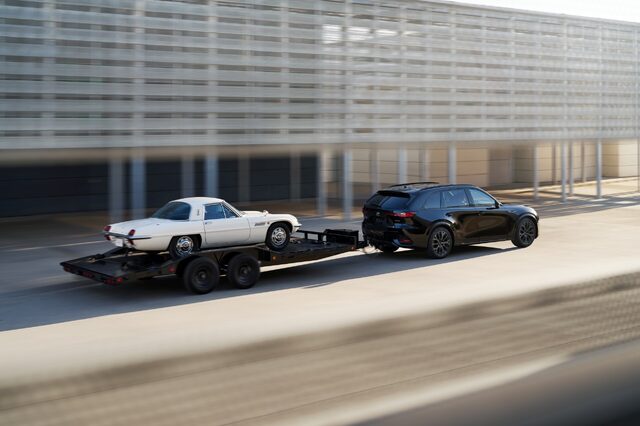 2025 Mazda CX-70 towing a classic Mazda Cosmo Sport