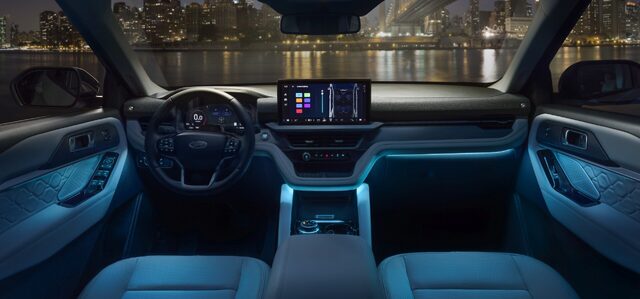 2025 Ford Explorer Platinum interior with blue ambient lighting at night
