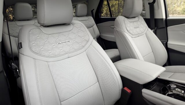 2025 Ford Explorer Platinum front seats with quilted leather and Platinum badge