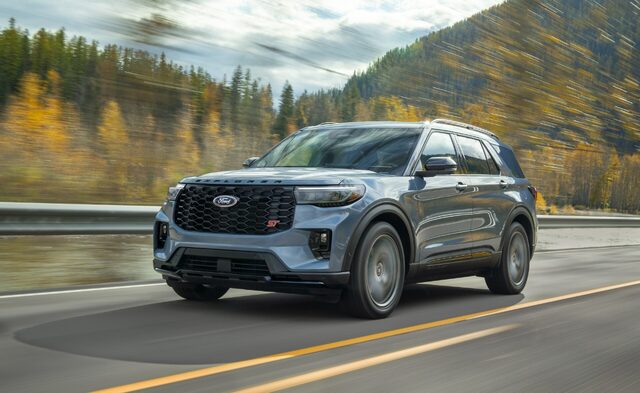 2025 Ford Explorer ST in blue driving on a mountain highway