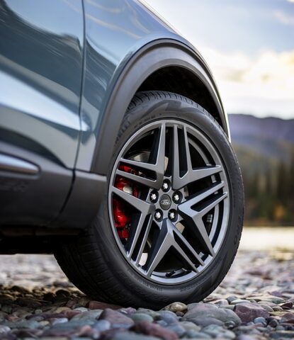 2025 Ford Explorer ST dark alloy wheel with red brake caliper closeup