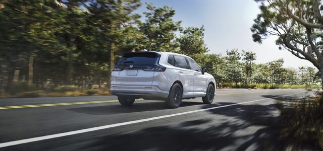 2025 Honda CR-V e:FCEV White Rear Three-Quarter on Coastal Road