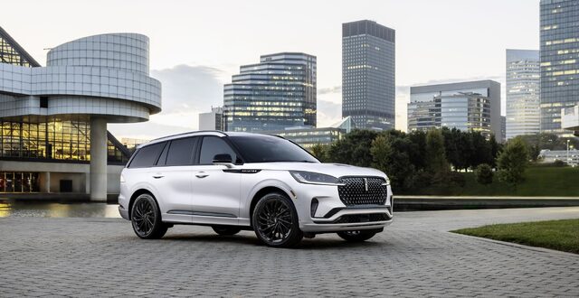2025 Lincoln Aviator front three-quarter view with city skyline