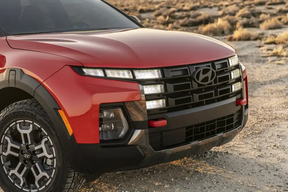 2025 Hyundai Santa Cruz XRT front three-quarter view in olive green