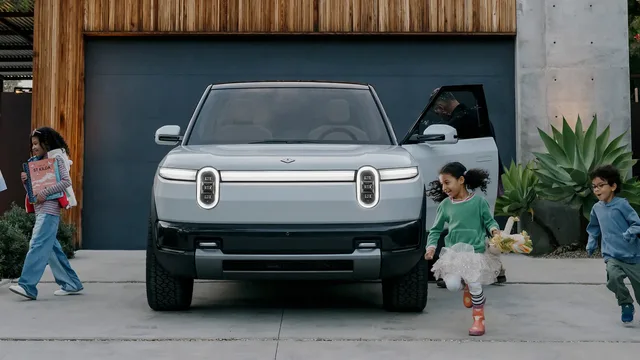 2026 Rivian R2 Front View in Driveway with Kids